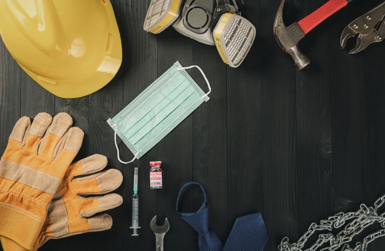 Tools, Hardhat and Hospital Equipment on a Table