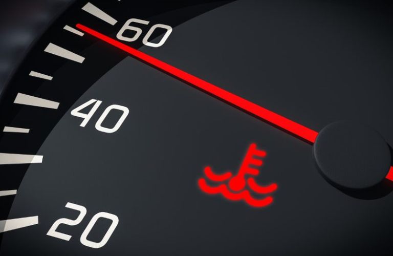 Warning sign of an overheated engine on the digital gauge cluster