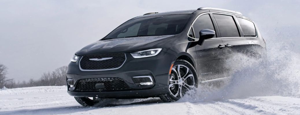 2023 Chrysler Pacifica Plug-in Hybrid driving in the snowy road
