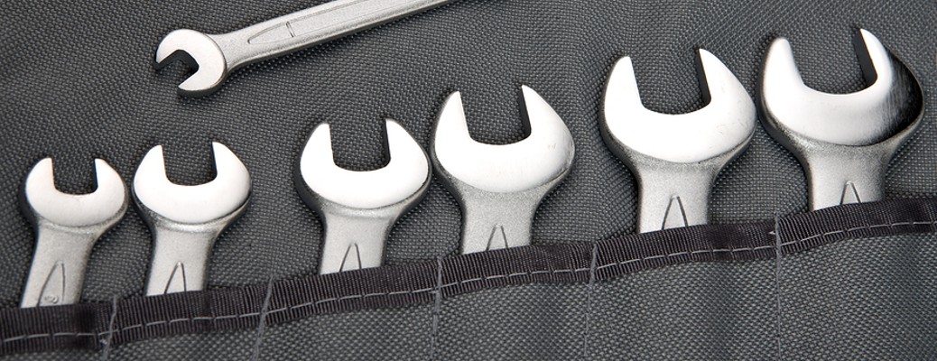 Wrenches in a line of pockets