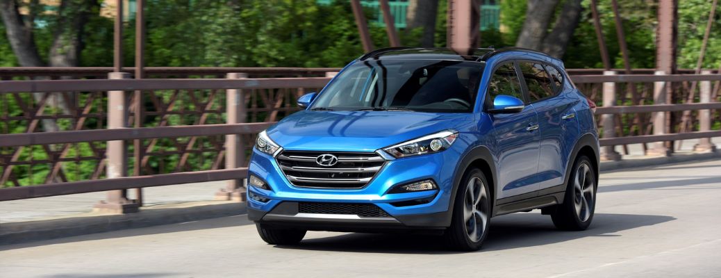2018 hyundai tucson driving on the highway at sunset