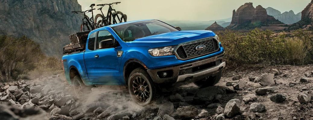 Front view of the 2023 Ford Ranger climbing rocks