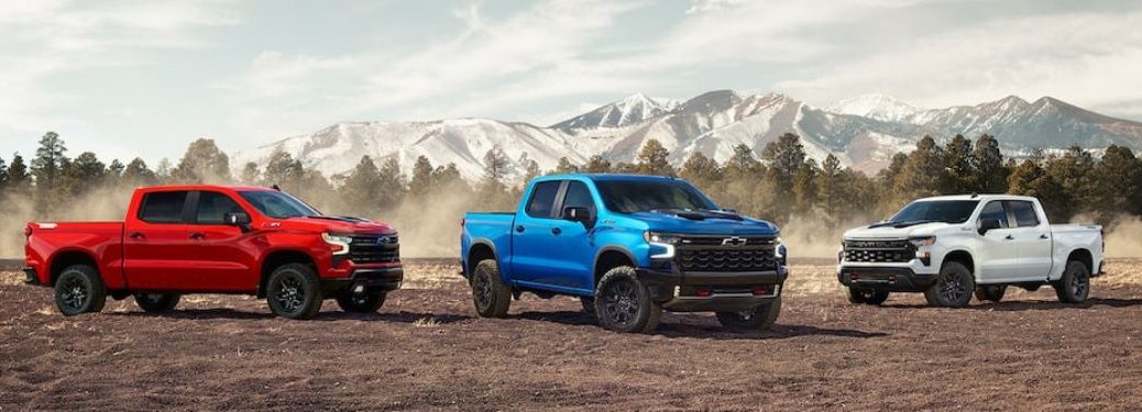 Red, White and Blue 2023 Chevy Silverado 1500 Models in the Mountains