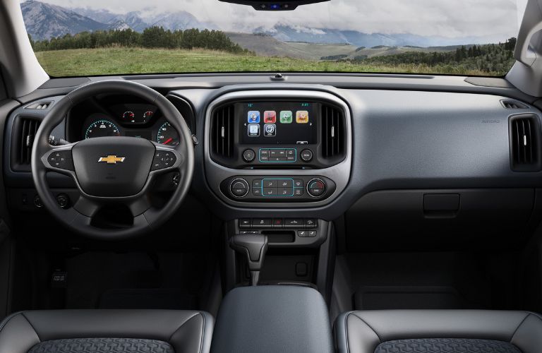 front interior of 2018 chevy colorado including steering wheel, seats and center console