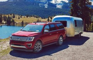 red 2018 ford expedition towing silver camper trailer 