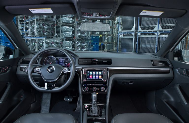 front interior of 2018 volkswagen passat including steering wheel and center infotainment system