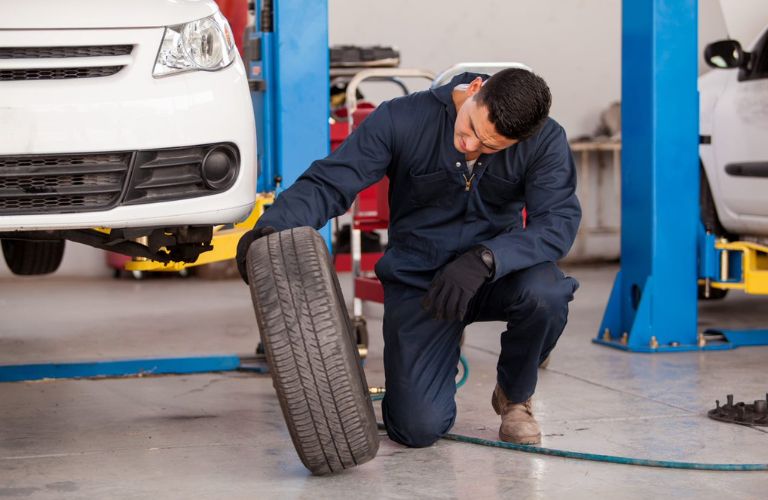 Mechanic inspecting a tire