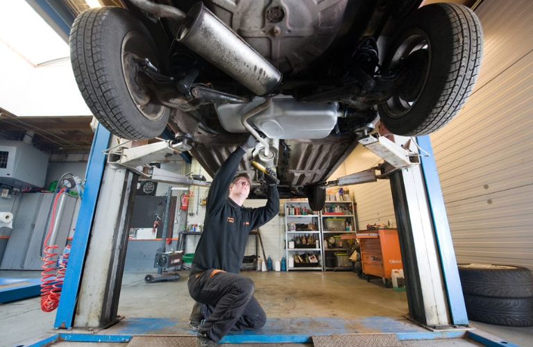 Vehicle mechanic working in an auto repair shop