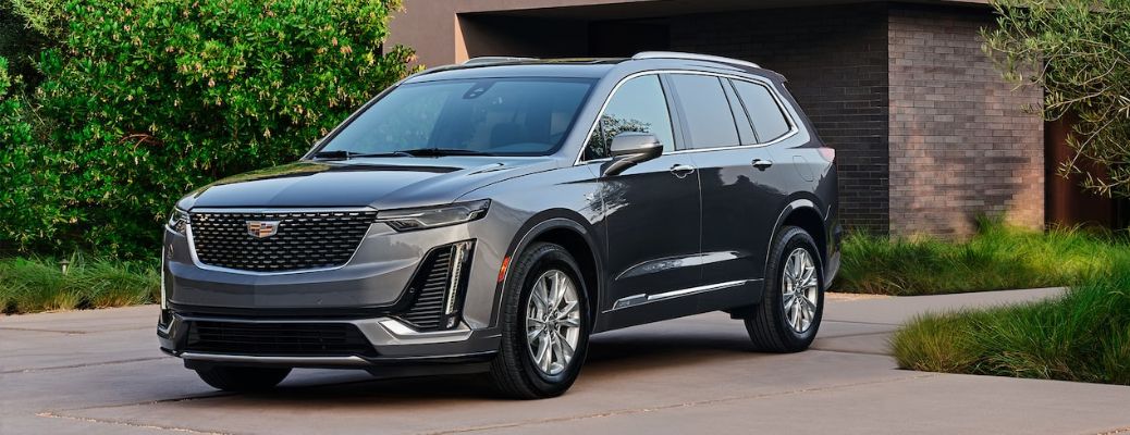 2022 Cadillac XT6 parked in front a house