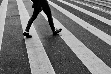 Person crossing street in crosswalk