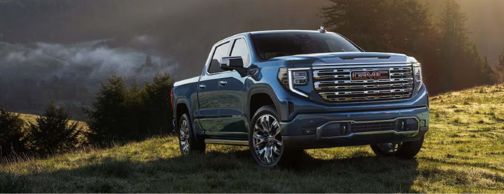 2025 GMC Sierra truck front view on a mountain