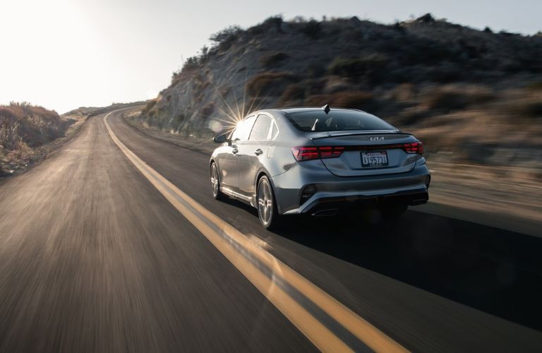 Back view of the 2023 Kia Forte on the highway.