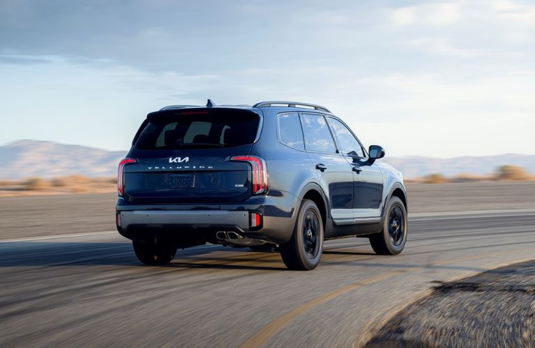 The rear view of the 2023 Kia Telluride on the highway.