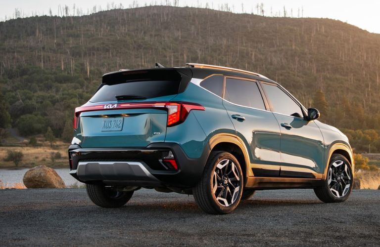 Back view of a blue 2024 Kia Seltos. 