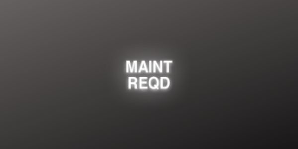 Black Background with White MAINT REQD Symbol