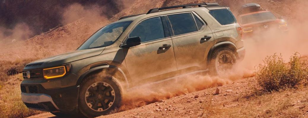 side view of the 2025 Honda Passport in the sand