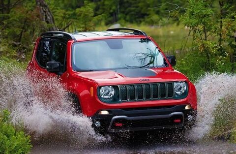 2023 Jeep Renegade Red crossing a stream