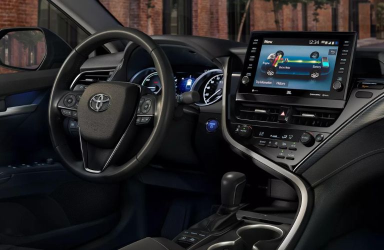 The steering wheel area of the 2023 Toyota Camry Hybrid is shown.