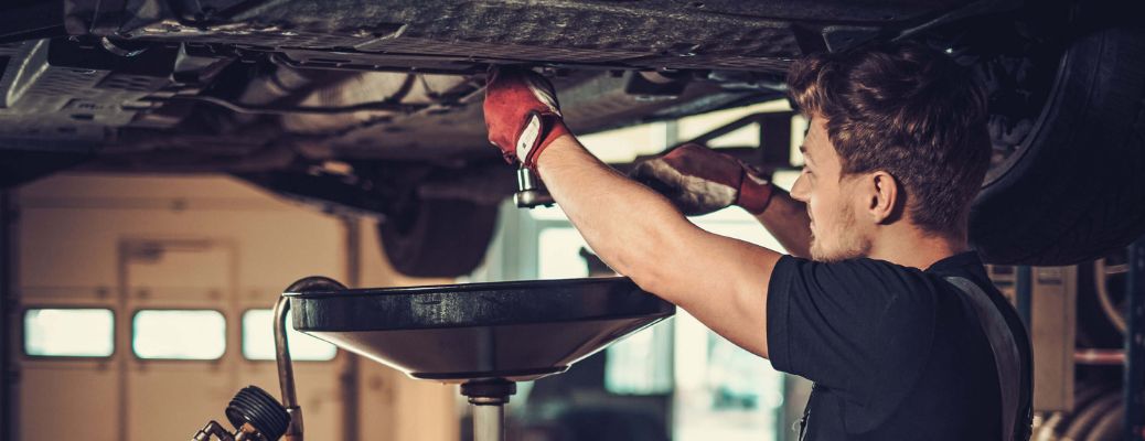 Mechanic fixing the oil leakage