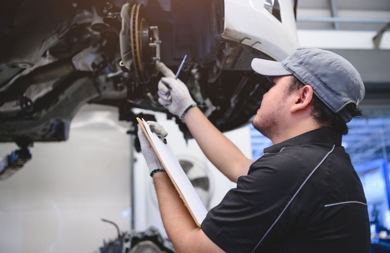 A mechanic working on a car