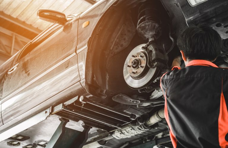 A mechanic fixing a car