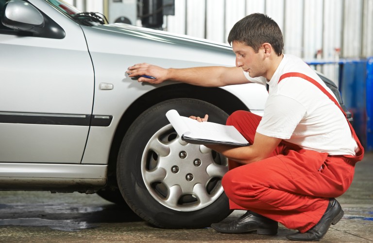 A mechanic working on a vehicle