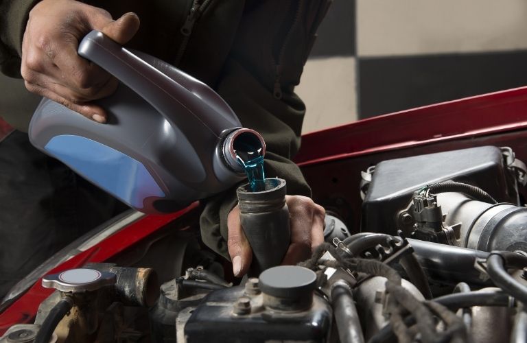 A mechanic working on a vehicle