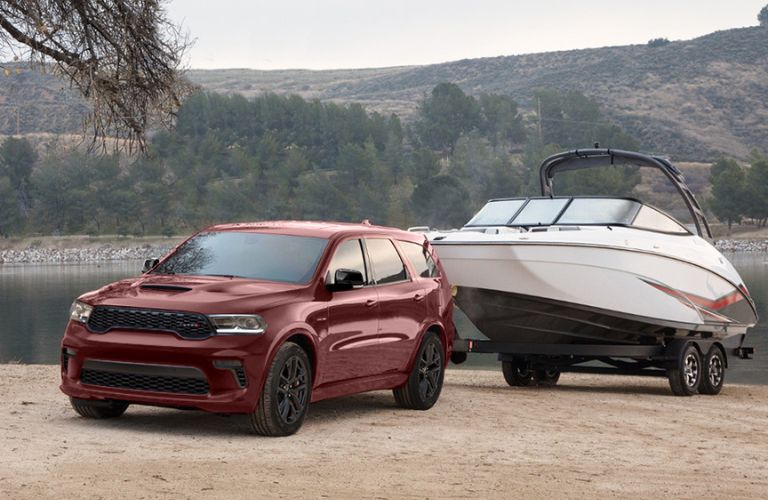 Used Dodge Durango Red towing a boat