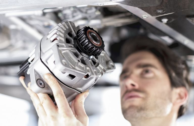Service technician working on a vehicle
