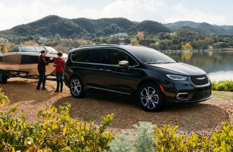 Side view of the 2023 Chrysler Pacifica near a lake