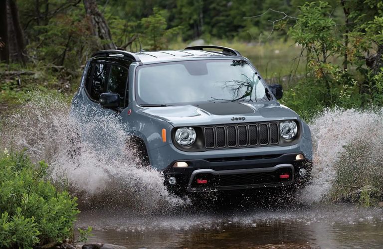 2023 Jeep Renegade cruising through a water stream