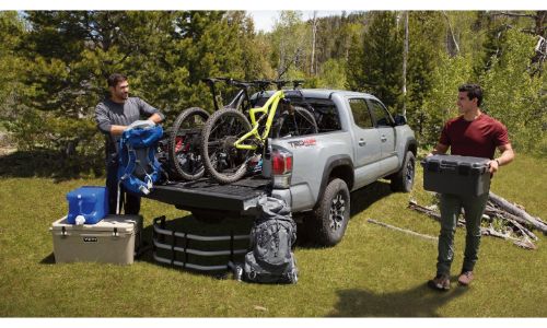 2020 Toyota Tacoma white with bikes in bed and bed extender