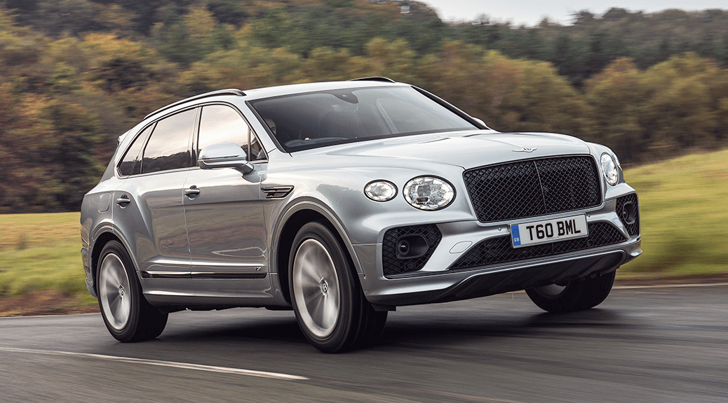 Front view of the Bentley Bentayga V8 driving down a road