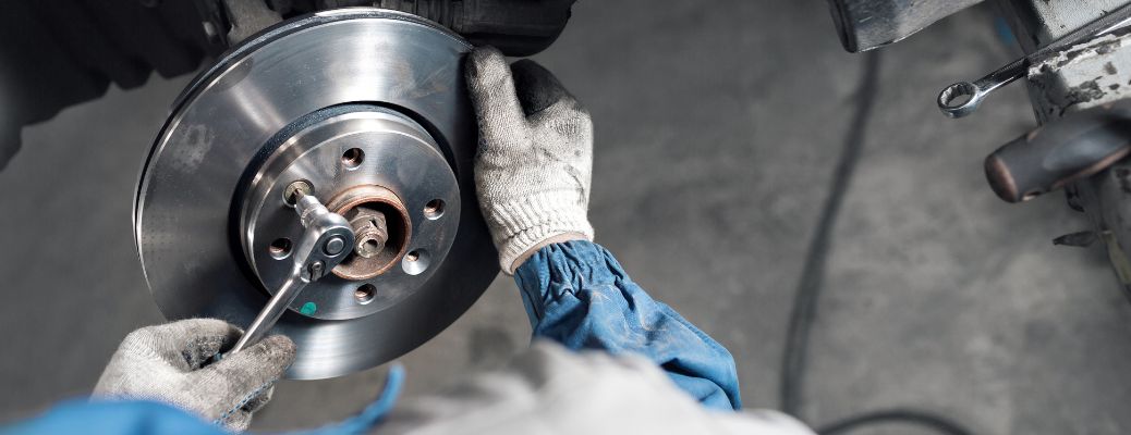 Technician repairing brake