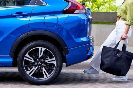Woman Using Foot to Activate Handsfree Liftgate on 2024 Mitsubishi Eclipse Cross