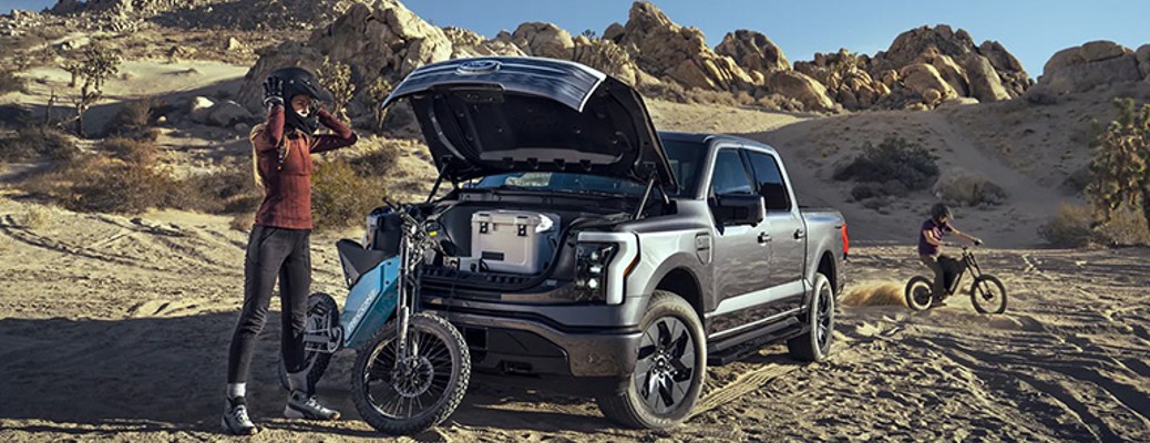 2023 Ford F-150 Lightning with a person and a bike