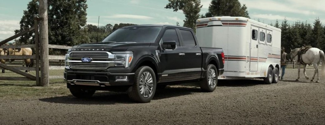 2025 Ford F-150 towing a trailer on a farm