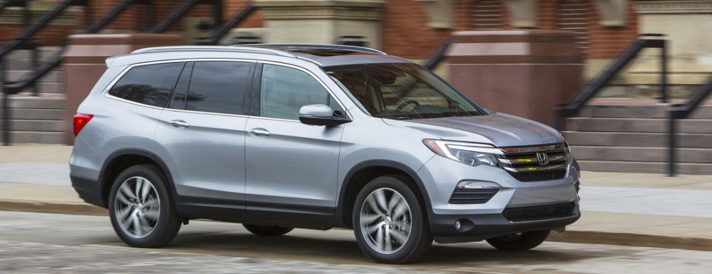 Exterior shot of the 2016 Honda Pilot moving on a road