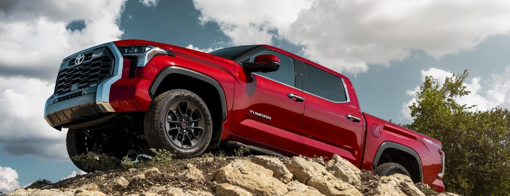 red 2024 Toyota Tundra on a rocky incline